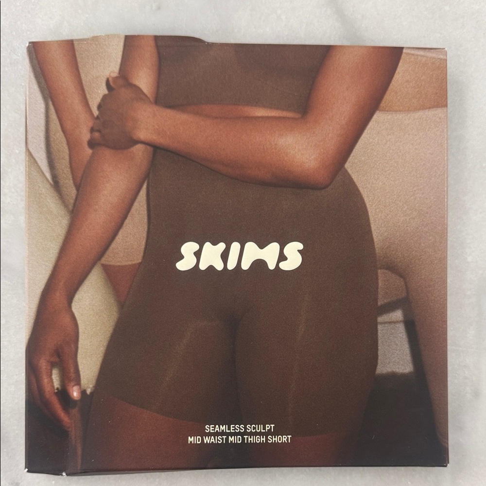 SKIMS Sculpting Mid-Thigh Shorts in Brown